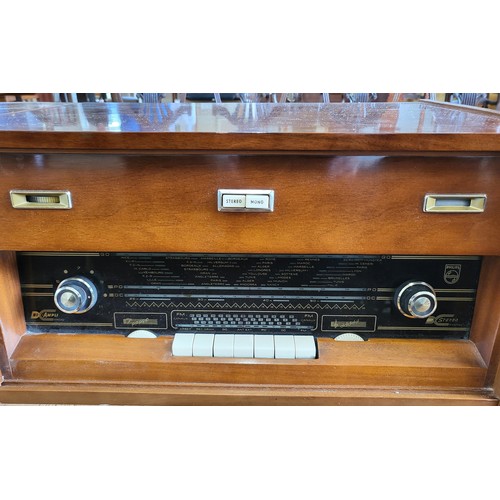 55 - A mid-century 'Philips F6X13 A' Bi-Ampli radio and turntable stereogram. Turntable has four speeds. ... 