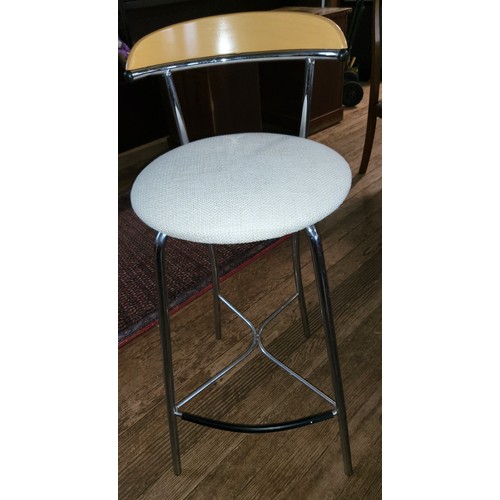 57 - A set of four 1970s beechwood and chrome-framed kitchen bar stools, with white seats.