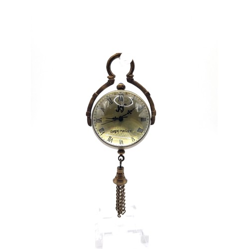 71 - A brass and glass desk ball clock.