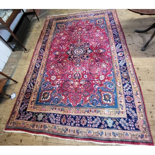 78 - A Persian Mashad floor rug, traditional floral medallion design, polychrome decorated, multi-bordere... 