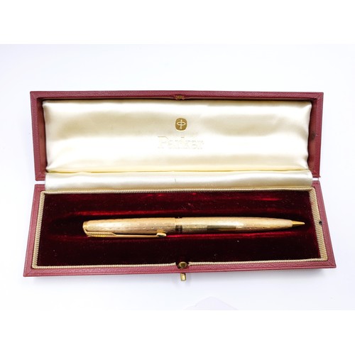 A 9ct yellow gold cased Parker pencil, the engine-turned body with ...