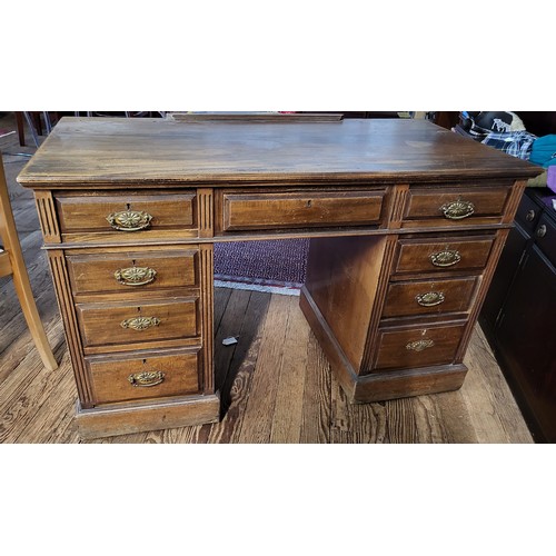 63 - A 20th century wooden twin pedestal desk, fitted with eight drawers, brass handles, plain top. 78cm ... 