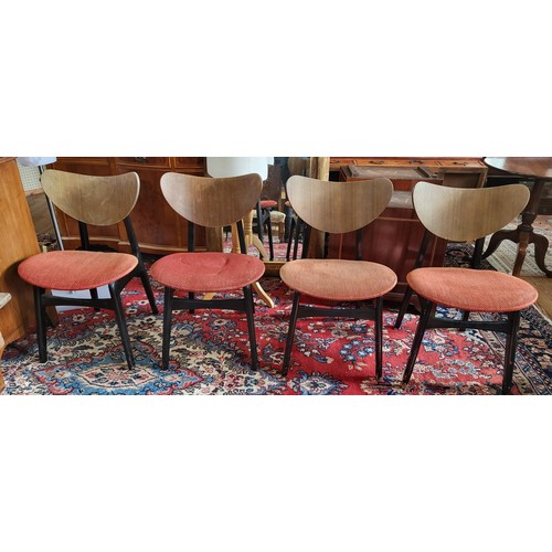 65 - A set of four G-plan Tola butterfly dining chairs, with kidney-shaped wooden backs, possibly walnut,... 