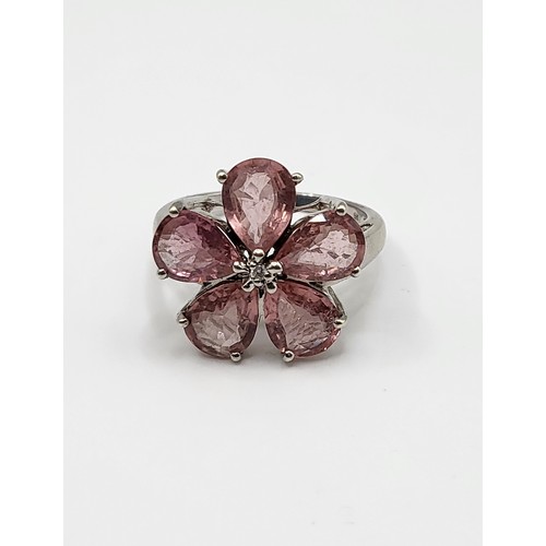 382 - A 9ct white gold and pink tourmaline floral cluster ring, set with five mixed pear-cut petals, centr... 