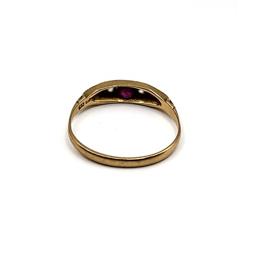 383 - An 18ct yellow gold, diamond, and ruby ring, set with a larger round-cut ruby, two old-cut diamonds,... 