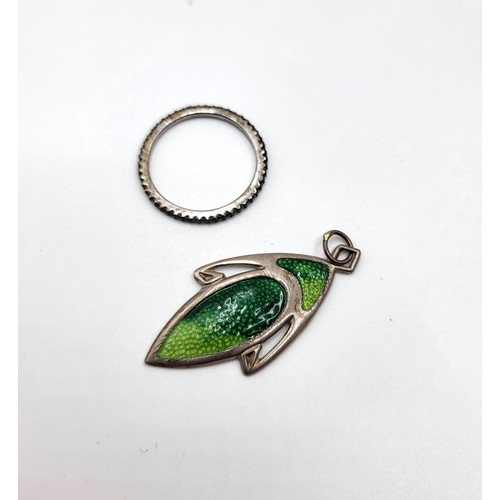 385 - An Art Nouveau silver and enamel pendant, of elongated form, decorated with light and dark green ena... 