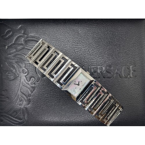 391 - Versace. A stainless steel ladies wristwatch, with rectangular mother-of-pearl dial, Roman numeral a... 