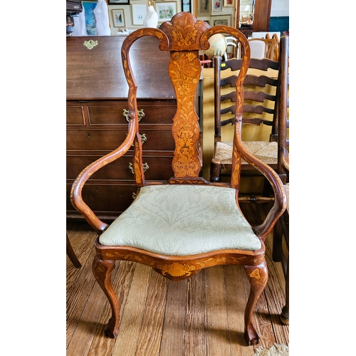 69 - A 19th century Queen Anne style walnut inlaid chair, with splatted back, curved arms, and supported ... 