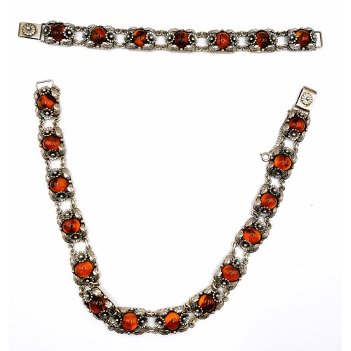 378 - Niels Erik From (1908-1986), Danish. A mid century silver and amber necklace and matching bracelet, ... 