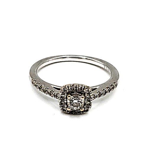 389 - An 18ct white gold and diamond engagement ring, centred with a round brilliant-cut diamond of approx... 