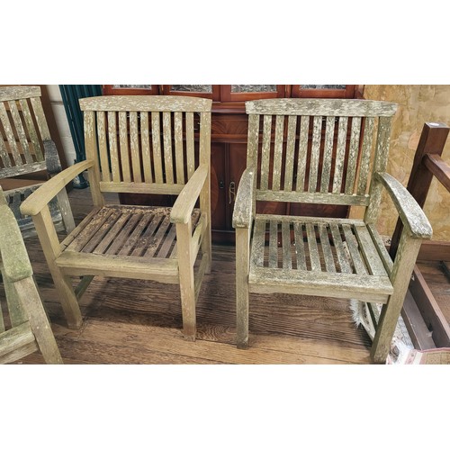 17 - A wooden garden bench 162cm (w), together with four matching chairs.