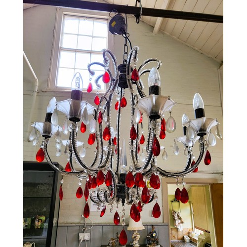 21 - An unusual pair of eight branch glass chandeliers with red and clear glass droplets. 94cm x 68cm.