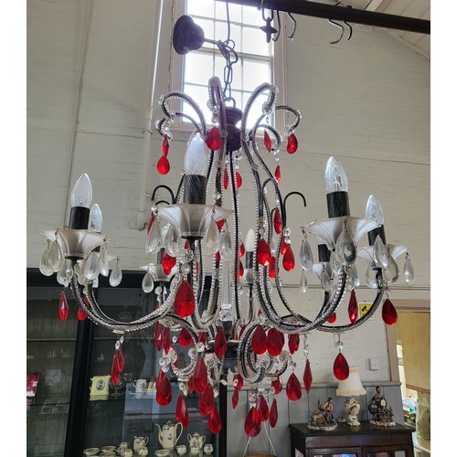 21 - An unusual pair of eight branch glass chandeliers with red and clear glass droplets. 94cm x 68cm.