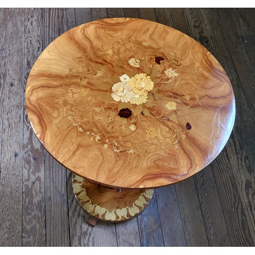 40 - A late 20th century circular marquetry occasional table on a turned pedestal. 62cm x 52cm.