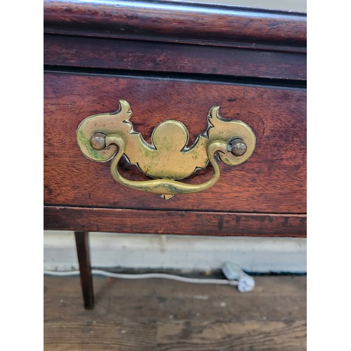 57 - A late 19th / early 20th century mahogany side table with one drawer, brass handles, supported on sq... 