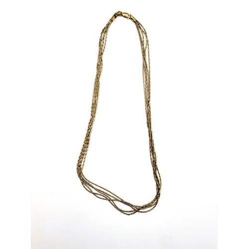 335 - An Italian yellow and white metal chain, comprised of five textured strands, the clasp marked 750.