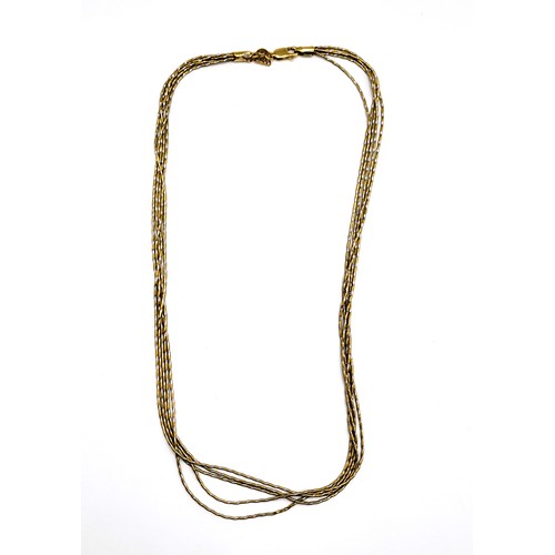 335 - An Italian yellow and white metal chain, comprised of five textured strands, the clasp marked 750.