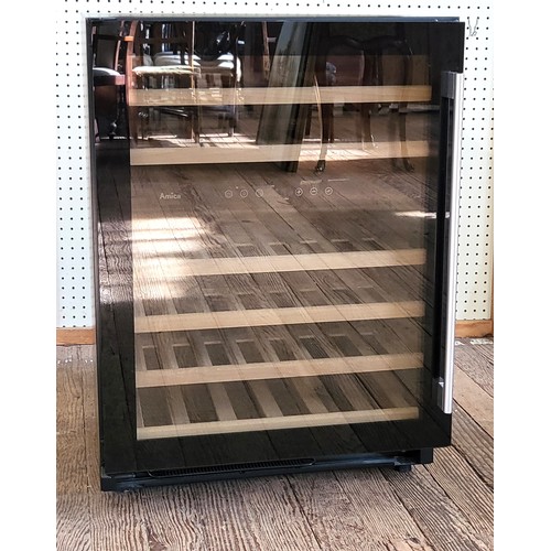 68 - An Amica wine fridge with six shelves. 84cm x 60cm x 57cm.