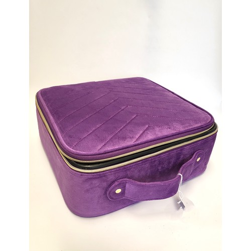 341 - A purple fabric travelling jewellery case, with zips and handle, square.