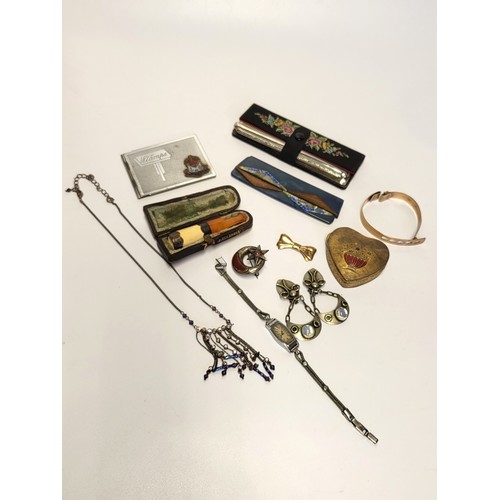 343 - A small group of miscellaneous items, including a yellow metal brooch, a Scottish moon and star silv... 