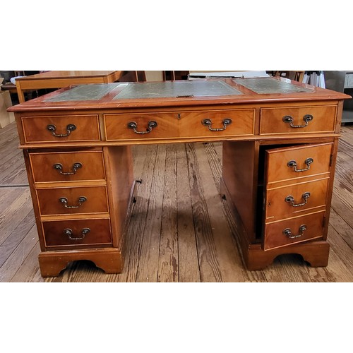 67 - A wooden pedestal desk, with green leather top, in three parts. Left cabinet has three drawers, righ... 