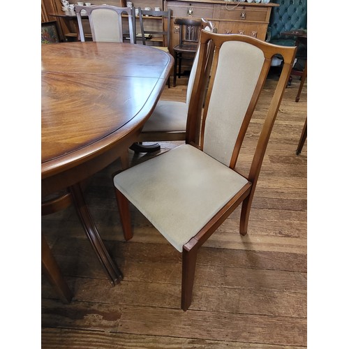 19 - A Meredew extending dining table and six chairs (including two carvers). 74cm x 148cm x 95cm, unexte... 