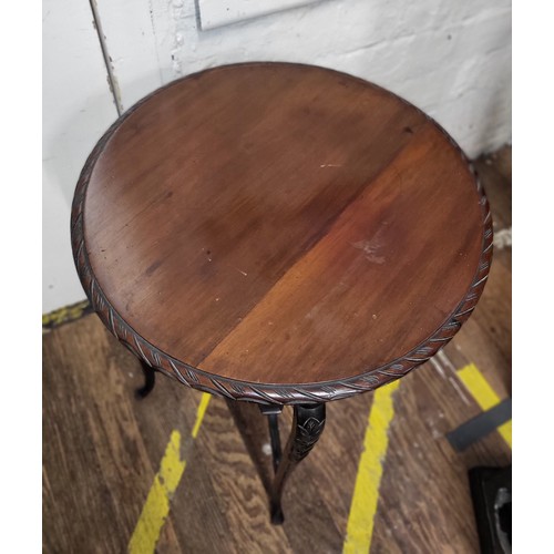 21 - A mahogany Regency-style  occasional table. Damage to surface.