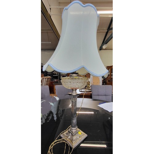 32 - Two crystal stem lamps with modern shades ( 78cm and 69cm) and a silver plate lamp with modern shade... 