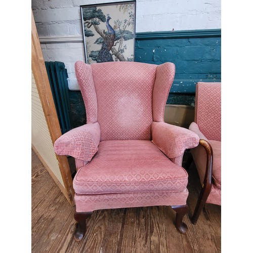 40 - A pink Parker Knoll upholstered sofa (87cm x 120cm x 64cm) and a pair of wingback chairs (96cm x 74c... 