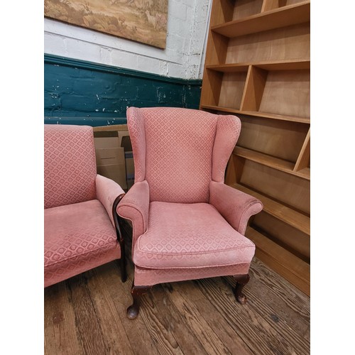 40 - A pink Parker Knoll upholstered sofa (87cm x 120cm x 64cm) and a pair of wingback chairs (96cm x 74c... 