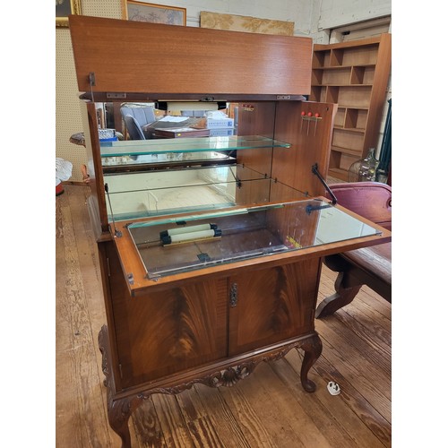 48 - A mahogany cocktail/ drinks cabinet with drop down front,original mirrored and inlaid glass back and... 