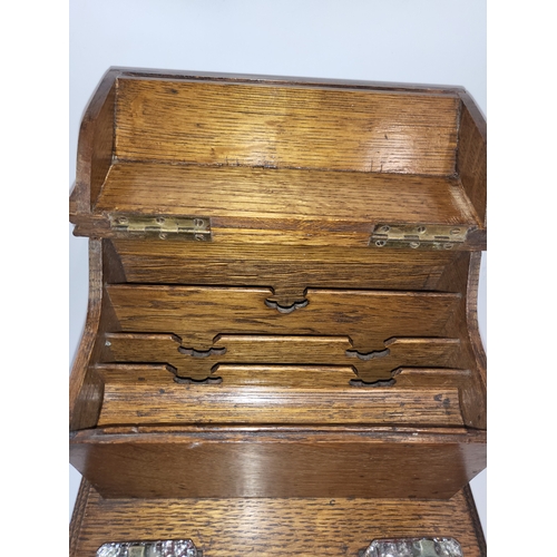 11 - A gentleman's desk set with stationery box and inkwells. Oak, 1900.