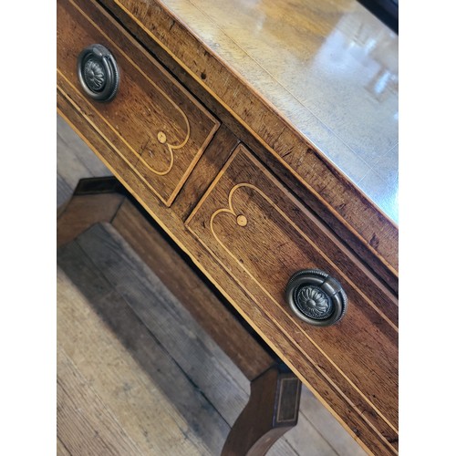 8 - A late Victorian light mahogany sofa table on a decorative four legged base with boxwood stringing a... 