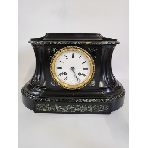 72 - A black marble clock and candlesticks