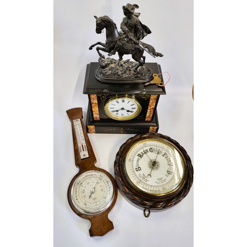 73 - A Welsh slate mantle clock with a Cavalier on horseback, a banjo barometer and an aneroid barometer