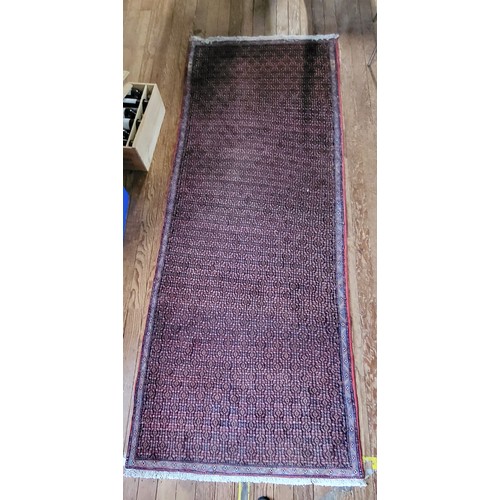 76 - A full pile cashmere rug, with floral medallion design, fringed. 170cm x 120cm.