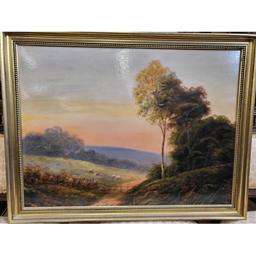 80 - An oil painting, sheep against a sunset by T Wood gilt frame. 62cm x 80cm framed