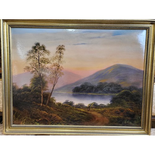 81 - An oil painting, mountainous lake scene. 62cm x 80cm.