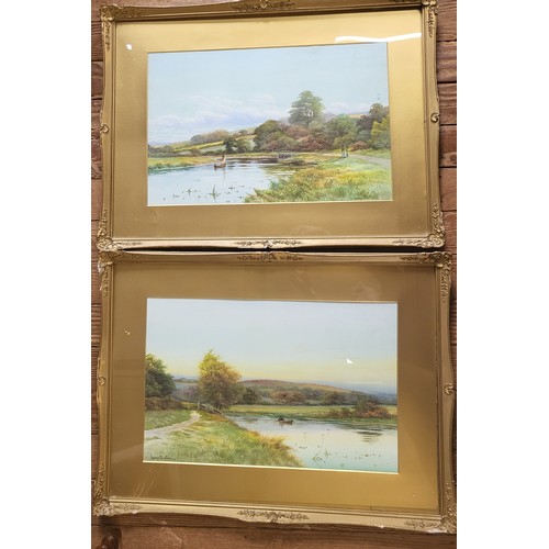 84 - A pair of  watercolour river scenes signed by George Oyston. framed and glazed. 51cm x 70cm