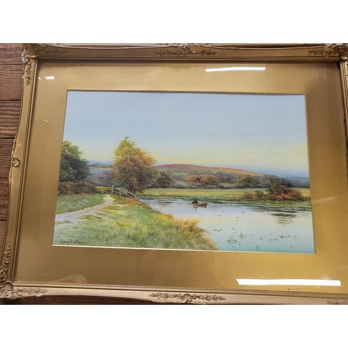 84 - A pair of  watercolour river scenes signed by George Oyston. framed and glazed. 51cm x 70cm