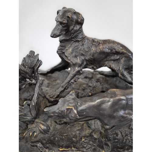 100 - A bronze of two hunting dogs on a marble base. 25cm x 46cm x 24cm.