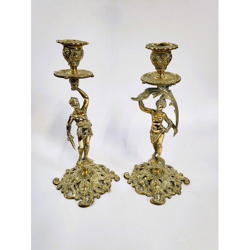 103 - A pair of brass Crimean commemorative war & peace candlesticks.