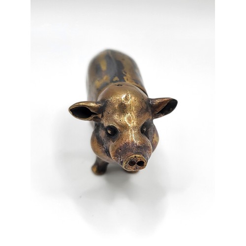 106 - A brass cased pig vesta case. 32g. 6cm x 3.5cm