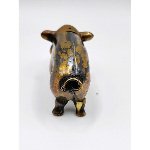 106 - A brass cased pig vesta case. 32g. 6cm x 3.5cm