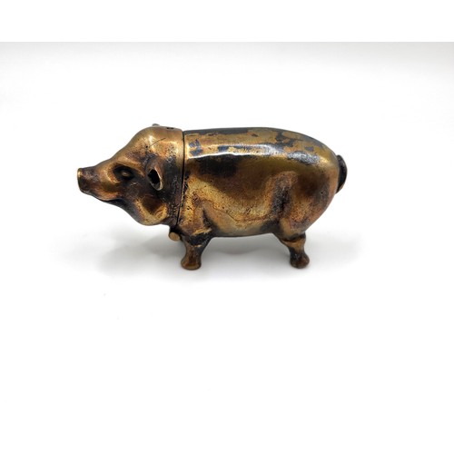 106 - A brass cased pig vesta case. 32g. 6cm x 3.5cm