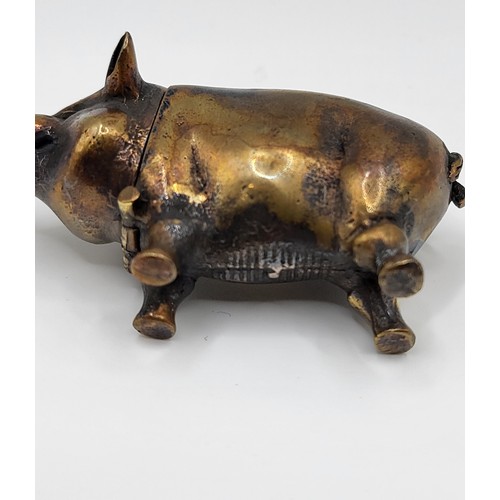 106 - A brass cased pig vesta case. 32g. 6cm x 3.5cm