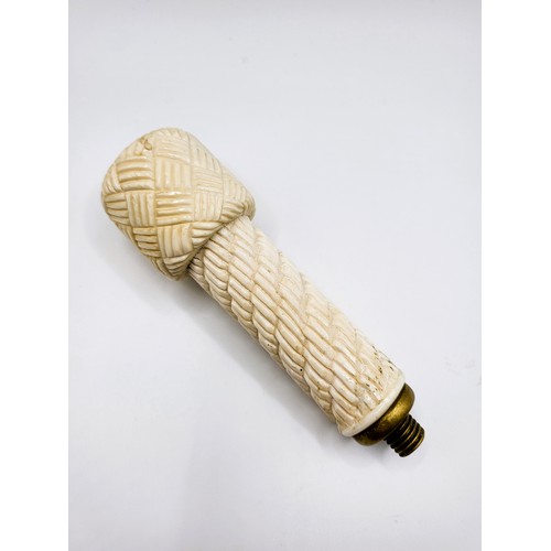 108 - A large carved bone walking cane handle. 12.5cm x 3.5cm. 158g