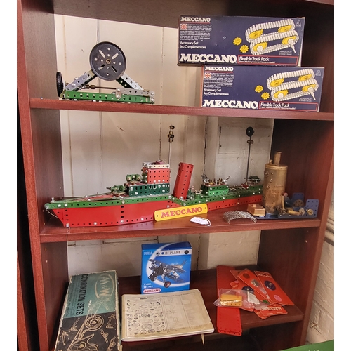 126 - Meccano battleship 73cm, steam engine 26cm x 74cm, two Flexible Track Packs, accessories, two catalo... 