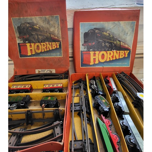 128 - Hornby O gauge clockwork No.2 Goods Set and No.21 Passenger Set in original boxes.