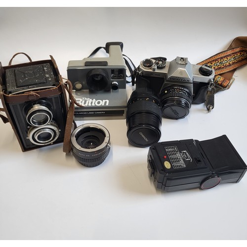 129 - A collection of photographic ware: a Pentax SLR camera, A Nishika flash gun,a Chinon lens and a Prin... 